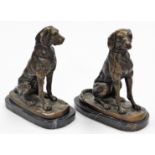 A pair of bronze finish spelter figures, of standing dogs on oval marble finish bases, unsigned, 24c