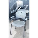 A set of ten stacking patio style chairs, with plastic backs, material mesh style seats and front me