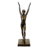 After Hromych. A bronzed Art Deco figure of a lady or ballerina, with arms raised, on a plain recta