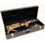 An Earlham French saxophone, with mother of pearl finished buttons, separate mouth piece and other a