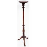 A early 20thC mahogany plant stand, the circular moulded top raised on a cylindrical stem terminatin