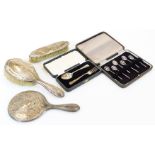 A George V matched silver three piece dressing table set, comprising clothes brush, Birmingham 1917,