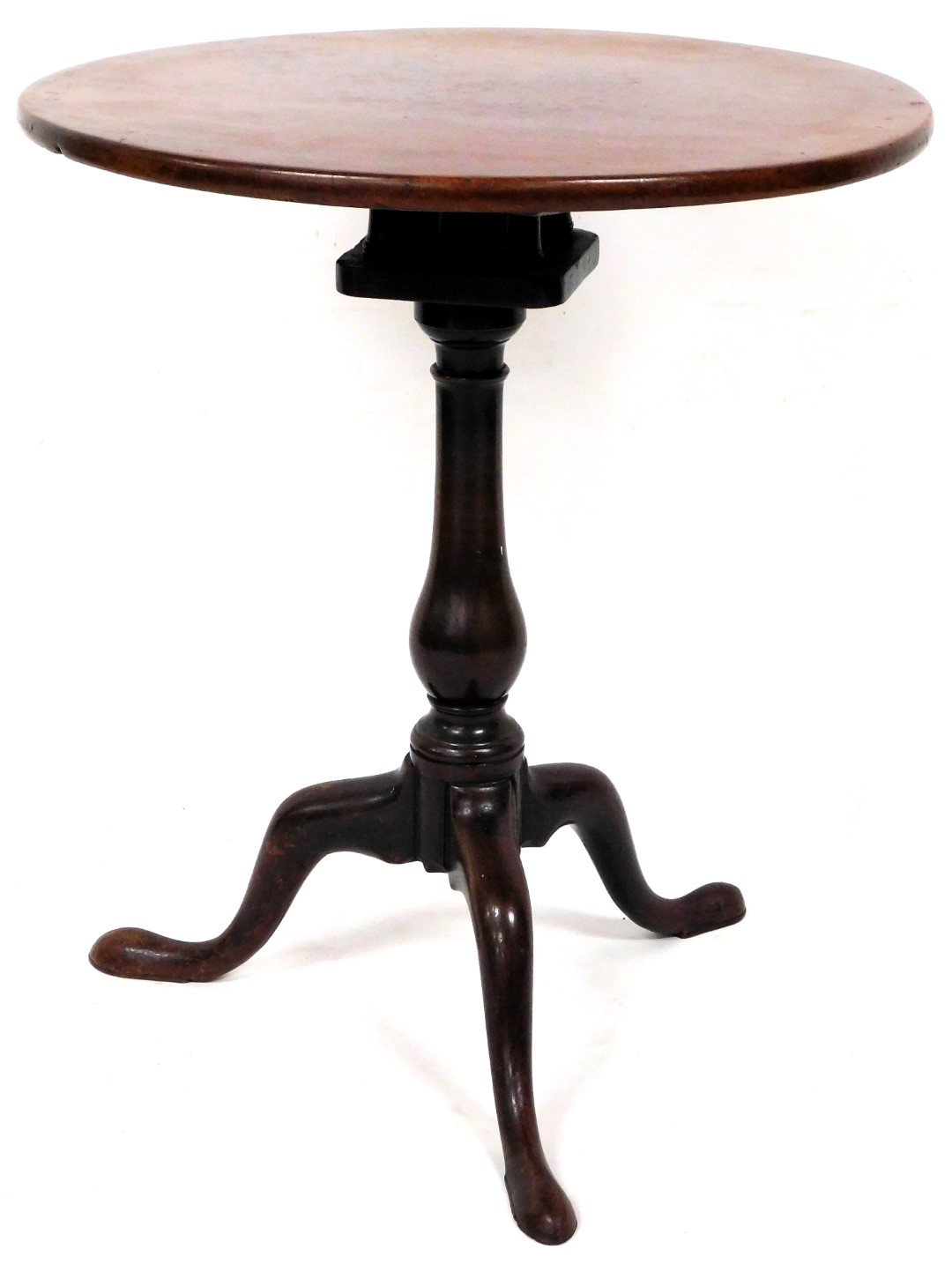 A George III mahogany one piece birdcage action tripod table, on plain baluster stem terminating in