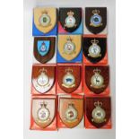 Various boxed RAF Heraldic Crests on wooden shield backs, to include Royal Air Force Station, 13cm w