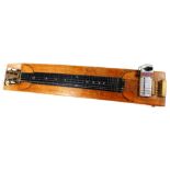 A 20thC slide guitar with an electric pickup, 75cm wide, top only on a partially inlaid inset base,
