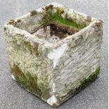 A stone planter, of square form, 36cm high, 36cm wide, 36cm deep.