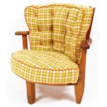 A 20thC oak Guillerme and Chambron curved chair, with later woven woollen feather cushions and a sha