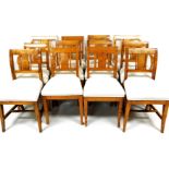 A set of twelve (10+2) 19thC Swedish birch dining chairs, each with fixed cresting rails, vertical s