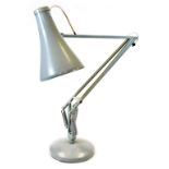A 20thC anglepoise lamp in grey, with cone shaped shade, the shade 22cm wide.