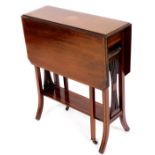 An Edwardian mahogany and boxwood strung Sutherland table, with canted top and gate leg action on sp