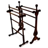 A late 19th/early 20thC clothes horse, with turned sections on turned stiles, terminating in horizon