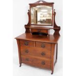 An early Edwardian walnut dressing chest, of two short and two long drawers with ring handles, on ca