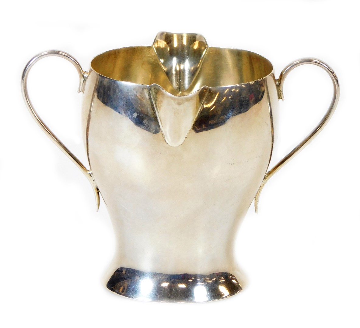 A Victorian silver double lipped Art Nouveau cream jug, by Samuel Walton Smith, with inverted body a