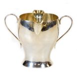 A Victorian silver double lipped Art Nouveau cream jug, by Samuel Walton Smith, with inverted body a