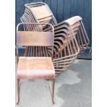 A set of eleven bent metal stacking chairs, with shaped wooden backs and seats, 83cm high.