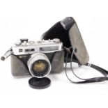 A Yashica G camera, 10cm high, with Japanese DX1:1.7 1=45mm lens.