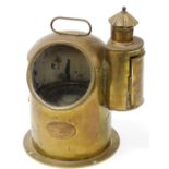A late 19thC brass ships compass, in a shaped domed case with articulated handle, the 9cm diameter d