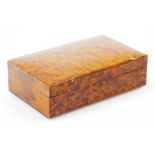 An early 20thC burr wood box, of rectangular form with a cedar style plain interior, 20cm wide.