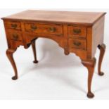 A George III style walnut lowboy, the rectangular crossbanded top quarter veneered with one long and