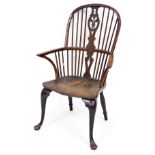 A 19thC yew and elm high back Windsor chair, with an oval stylised Prince of Wales feather splat, sh