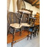 Three wheel back dining chairs, with hoop tops and additional cushions, each 77cm high, a teak coffe