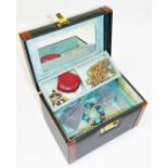 A vanity case, containing a quantity of various costume jewellery and effects, a cross set with faux