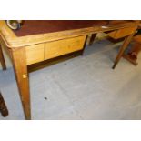 A 1920's oak desk, with single leatherette top, 79cm high, 140cm wide, 76cm deep.