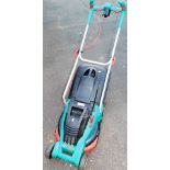 A Bosch electric lawnmower with grass box, 35cm wide.