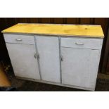 A painted kitchen dresser, of rectangular form, with yellow Melamine style top, raised above drawers