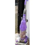 A Dyson Root Cyclone upright vacuum cleaner in purple.