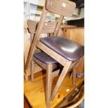 A pair of Melamine style retro dining chairs, with overstuffed leatherette seats, 71cm high.