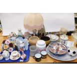 Various decorative china and effects, a large posy, onyx style table lamp, decorative teapots, peaco