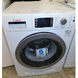 A Bosch Wash & Dry 7/4 series 6 washing machine, 86cm high, 61cm wide, 59cm deep.