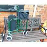 A garden bench, with wrought iron base and lattice back, 127cm wide, and a folding mobility walker.