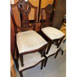 A set of four (2+2) Hepplewhite style shield back dining chairs, with serpentine overstuffed seats,