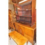 An Edwardian mahogany open bookcase, with lead glazed panel door and open shelves, a 1920's oak side