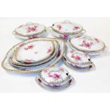 A Continental porcelain service, to include lidded tureen, serving dish, decorated with flowers, etc
