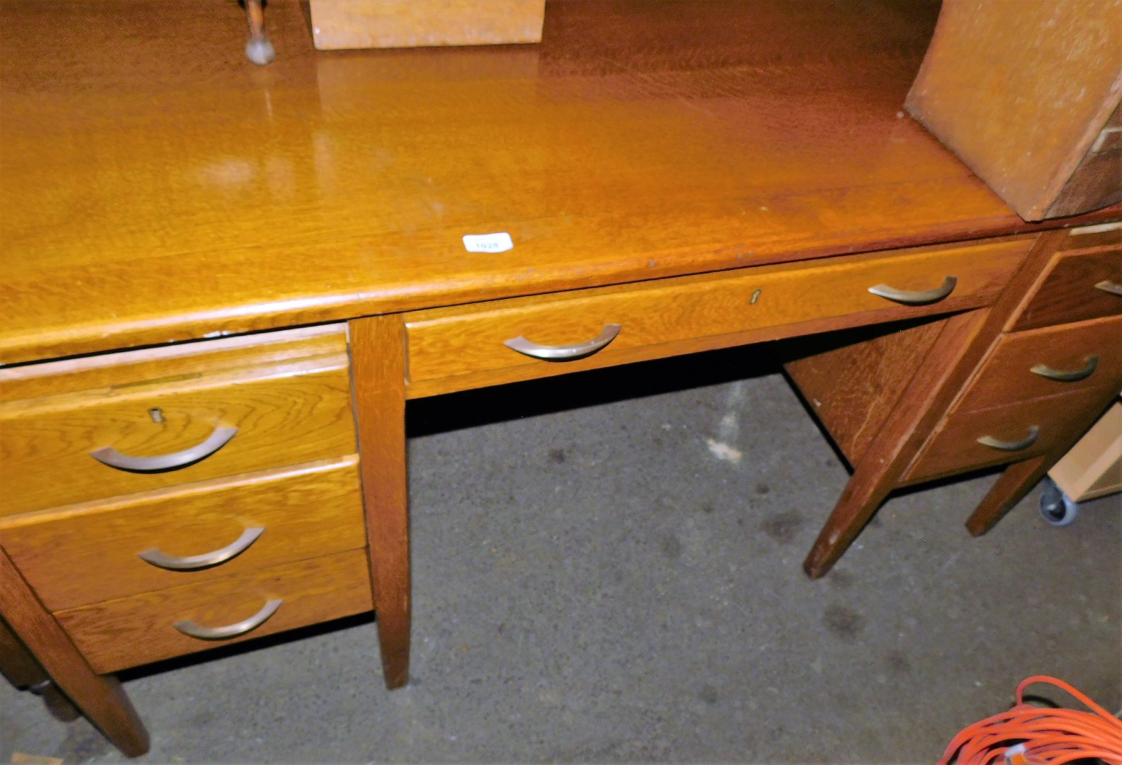 A 1920s oak desk, 75cm high, 150cm wide, 97cm, deep.