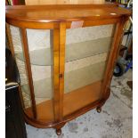 A mid 20thC walnut finish display cabinet, 112cm high, 103cm wide, 31cm deep.