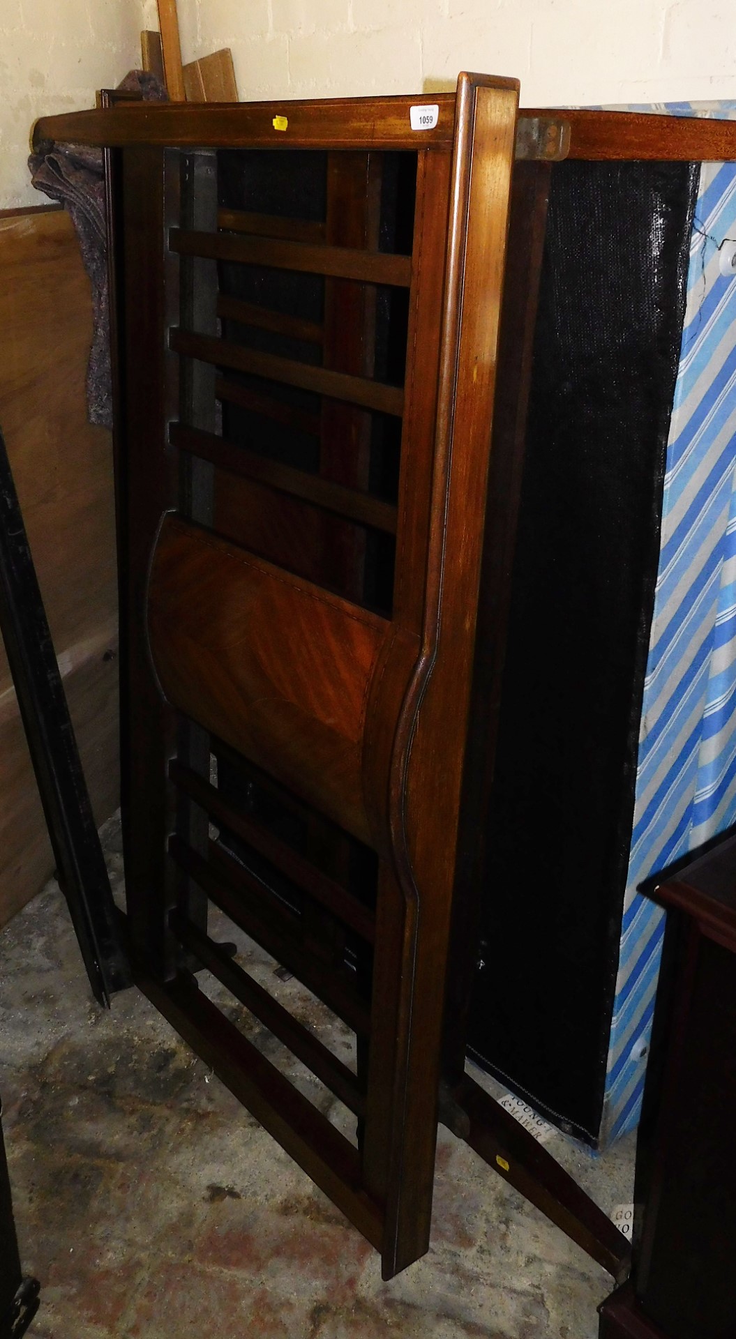 An Edwardian mahogany boxwood strung double bed frame, comprising headboard, footboard and supports