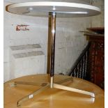 A Bene retro table, with circular top on a chrome stem, terminating in quadruple legs, with compress