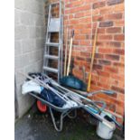 A wheelbarrow, 130cm wide, and various hand tools, gripe, edging spade, watering can, etc. (a quanti