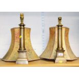 A pair of bronze finish decorative brass classical lamps with decorative shades.