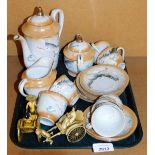 An Oriental tea service raised with dragons and two resin sedan chair figures. (a quantity)