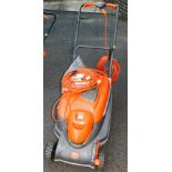 A Flymo electric lawnmower, 100cm high.