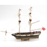 A wooden model of a warship The Galleon Portsmouth, with realistic decking and masts, set with
