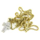 An 18ct gold and diamond set crucifix pendant and chain, with small crucifix pendant set with tiny