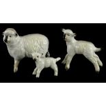 A graduated set of three Beswick sheep, the smallest lamb with repaired tail, the largest 9cm wide.