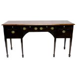 An Edwardian mahogany breakfront sideboard, the top with a moulded edge above two frieze drawers