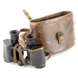 A pair of early 20thC military binoculars, the leather case stamped case number 2 prismatic